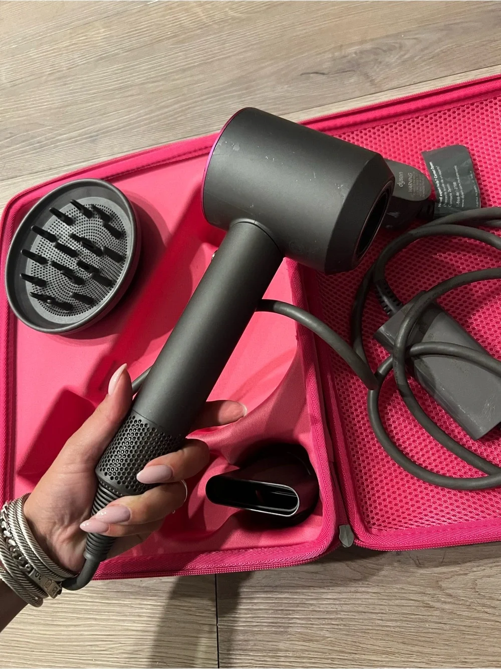 Dyson charcoal and pink travel case hair dryer with attachments